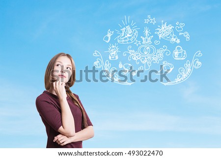Girl with braided hair is dreaming about her wedding ceremony. Light blue background. Concept of nuclear family and importance of its values. 