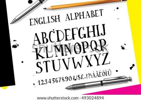 Hand drawn alphabet written with brush pen. Letters are decorated with color flowers.