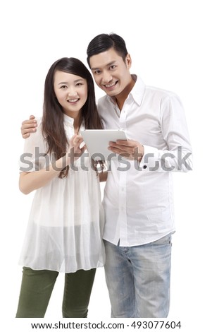 Oriental fashion young couples to use iPad