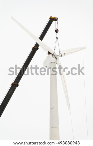 Installation of a wind turbine in winter Royalty-Free Stock Photo #493080943