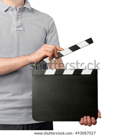 Close-up of young man holding blank clapper board isolated on white background