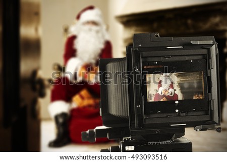 red santa claus and camera 