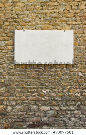 Blank marble plaque on italian stone wall