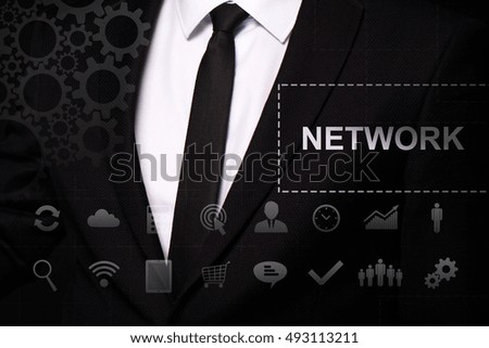 Businessman in the suit close. Text "Network" on the virtual screen badge, on the chest. Business concept. Internet concept.