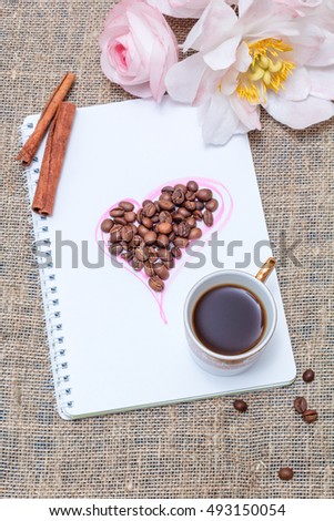 Morning coffee with cinnamon and sketchpad. Top view