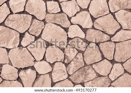 abstract texture of a facing stone of brown color for a background or for wallpaper