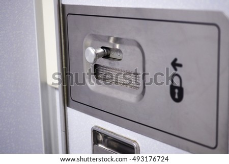 Airplane lavatory door lock handle.