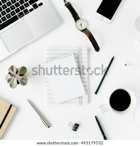 Flat lay, top view office table desk. Workspace with laptop, diary, phone, coffee, succulent and watch on white background.