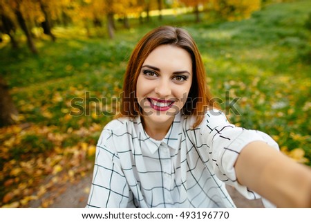 Autumn selfie portrait of a gourgeus excited girl.