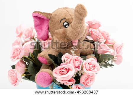 Happy smiling elephant with rose flower bouquet. Iron bucket/container. Image use for birthday, child birth,anniversary, valentin or other celebration,invitation. Romantic decor.Funny elephant toy. 
