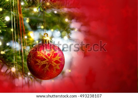 Christmas ball isolated on red background.