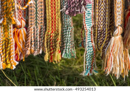 Bright multi-colored tapes for crafts. Ethnic Slavic belt for clothes