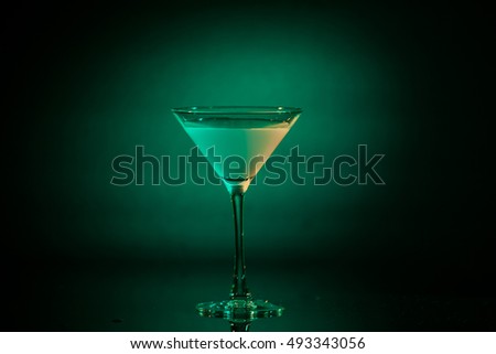 Green Cocktail In Martini Glass On Background At Party. Selective Focus.