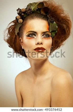 Beauty portrait redhead woman in autumn makeup
