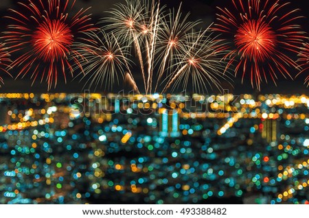 Multicolor fireworks with cityscape at twilight time, Blurred Photo bokeh