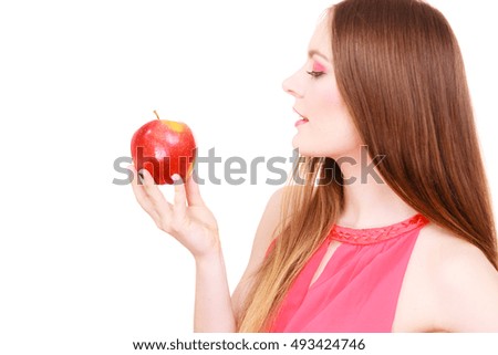 Woman young charming female long haired colorful make up holds big red apple fruit. Healthy eating, vegetarian food, dieting and people concept.