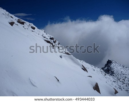 a beautiful rocky alpine landscape with snow