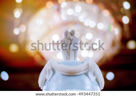 Bridal doll set on a wedding cake.
