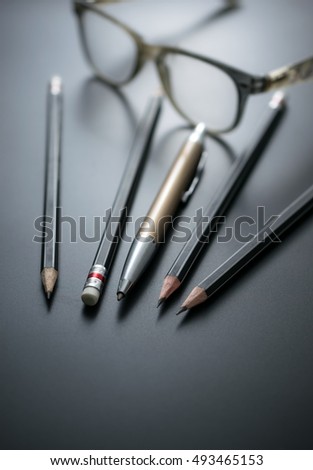 group of pencils on blackboard focus at pencil eraser, Concept sign for misconduct of management mistreating employees.