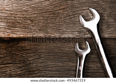 wrenches on wood background