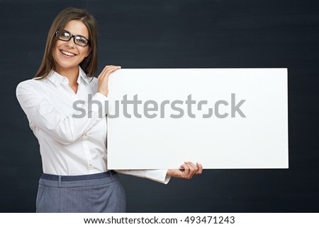 business woman holding white board show teeth with smile. white shirt.