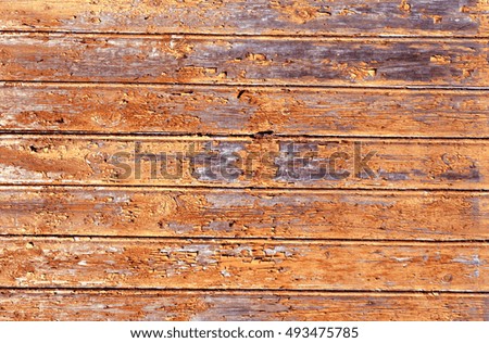 Orange weathered wood house wall. Abstract background and texture.
