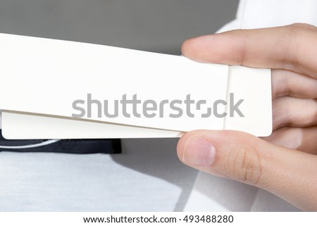 Woman showing label board price tag off new dress. clipping  path