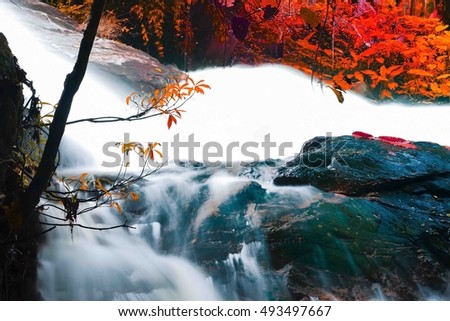 Waterfall in autumn forest at Pattalung Southern Thailand,select focus with shallow depth of field:ideal use for background.