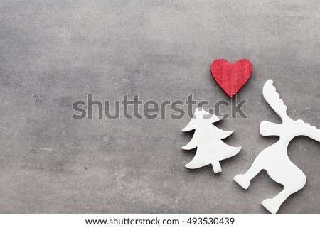 Christmas background. White tree decorations on a gray background. Deer. Spruce. Star. Angel.