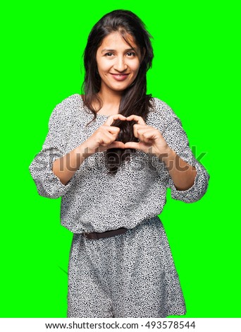 latin woman doing heart symbol