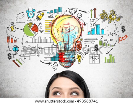 Close up of woman's head against concrete wall with giant light bulb and colorful startup sketch