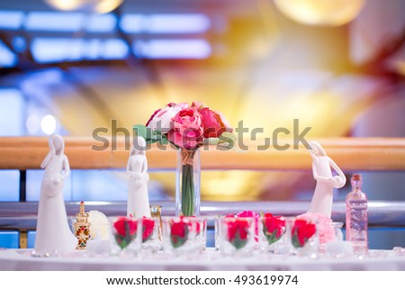 A bouquet in a glass distributed The decoration of the venue