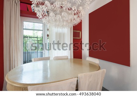 Interior, dining room with classic table and modern chandelier