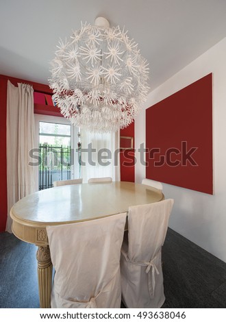 Interior, dining room with classic table and modern chandelier