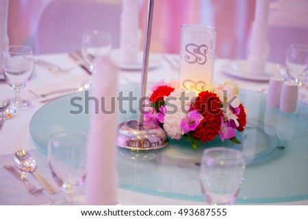 Floral decorations placed on the table.