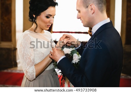 Beautiful luxury newlyweds exchanged wedding rings