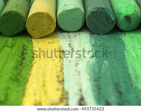 green artistic crayons