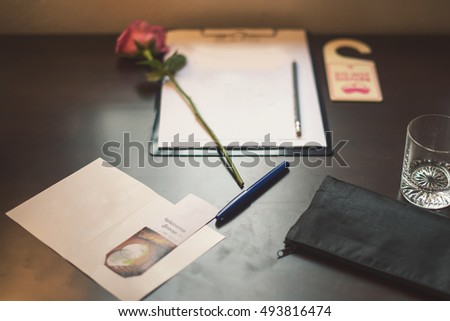 Welcome note paper on table selective focus