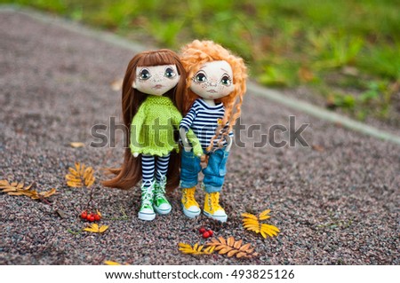 Cute textile dolls for a walk in the autumn Park