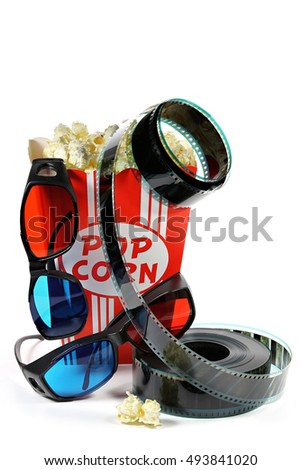 popcorn in a cardboard container with filmstrip and anaglyph glasses isolated on white background