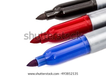 Three felt-tip pens markers highlighters close-up, isolated on white background