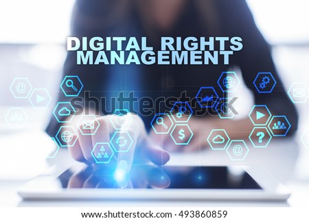 Woman is using tablet pc, pressing on virtual screen and selecting "Digital rights management".