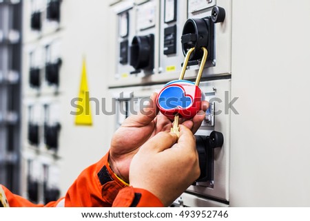 Lockout Tagout , Electrical safety system separated power or energy from electrician or worker. Royalty-Free Stock Photo #493952746