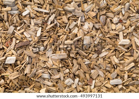 Woodchips used as safe soft surface in a childrens play park, Top Down View Royalty-Free Stock Photo #493997131