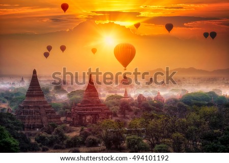 Hot air balloon over plain of Bagan in misty morning, Mandalay, Myanmar Royalty-Free Stock Photo #494101192