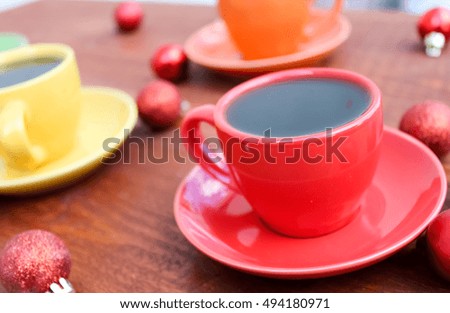 Cup of tea and christmas balls