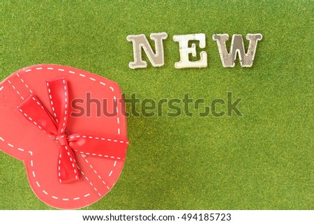 new: paper cut alphabet on green grass