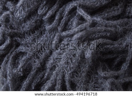 A full page of grey chunky knitwear fabric background texture