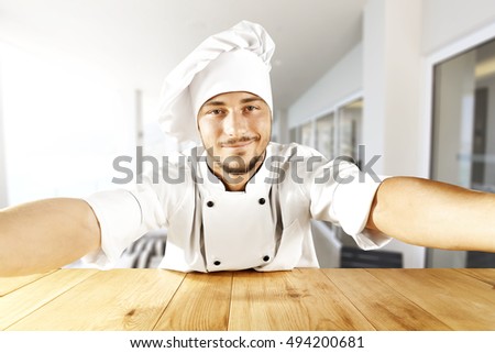 young cook chef making selfie 