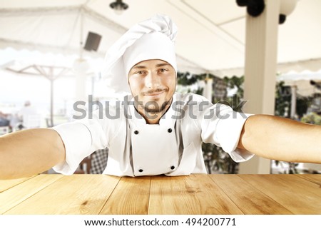 young cook chef making selfie 